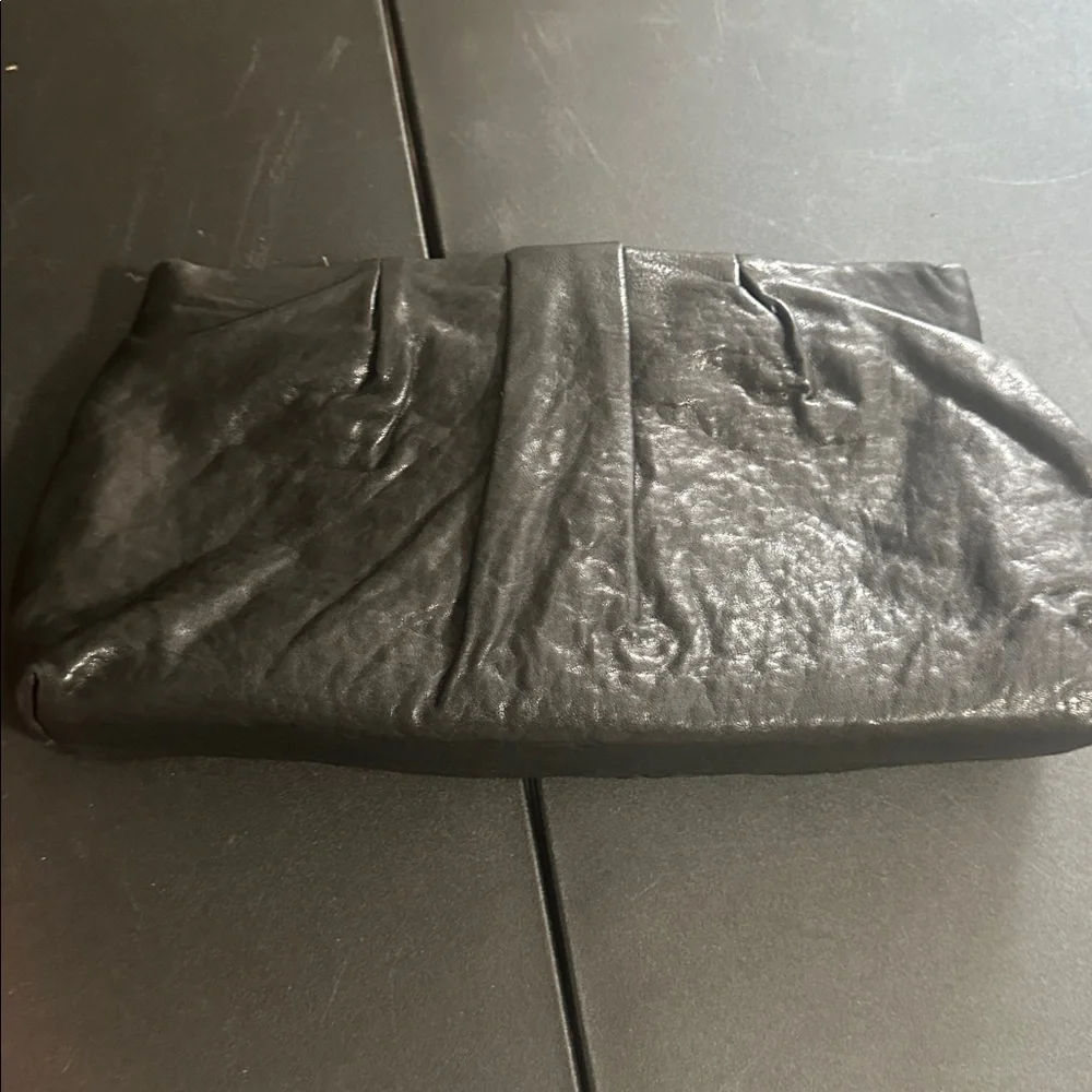 Stella & Dot black leather with feather CZ accent clutch bag
